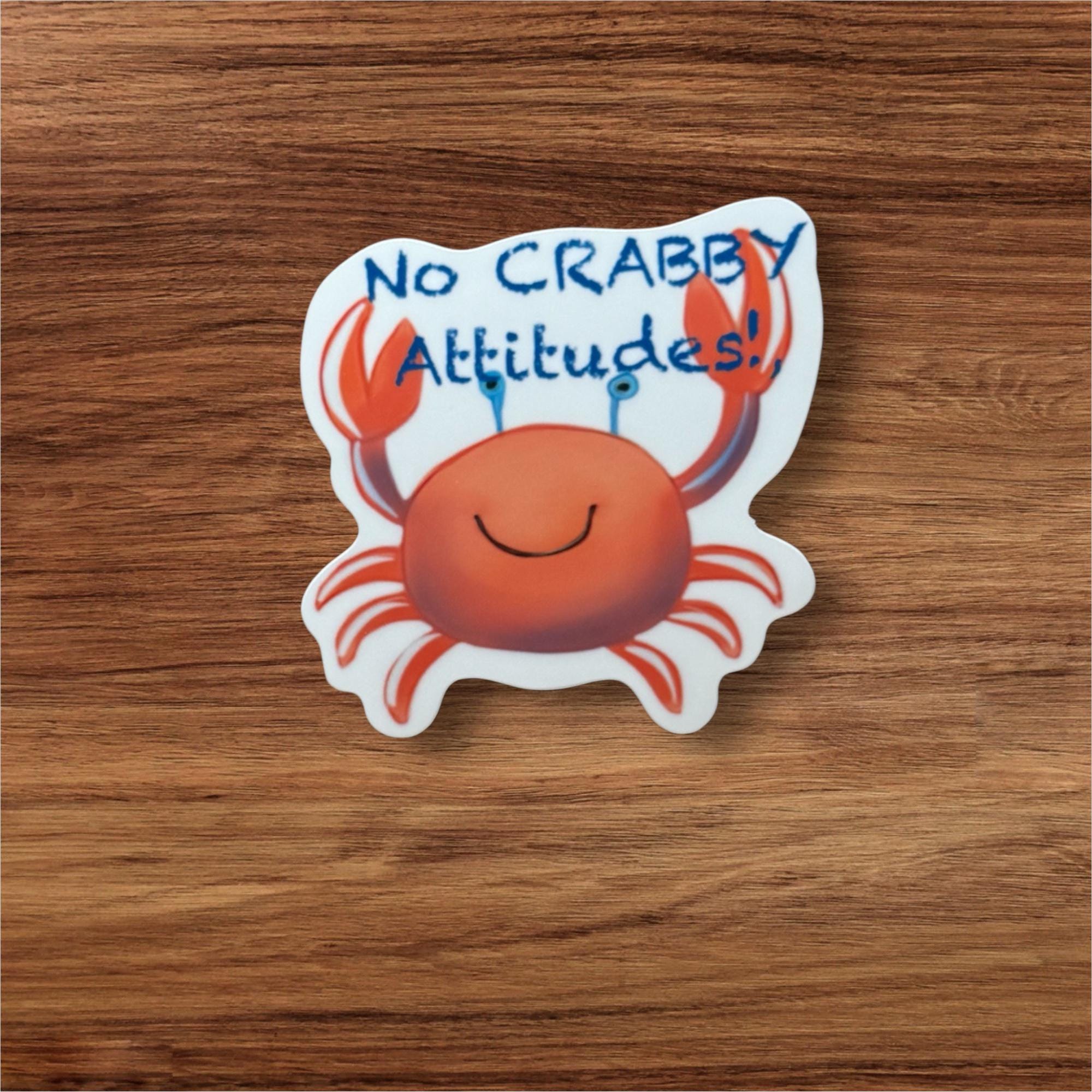 A sticker with a crab and the text "No Crabby Attitudes!"