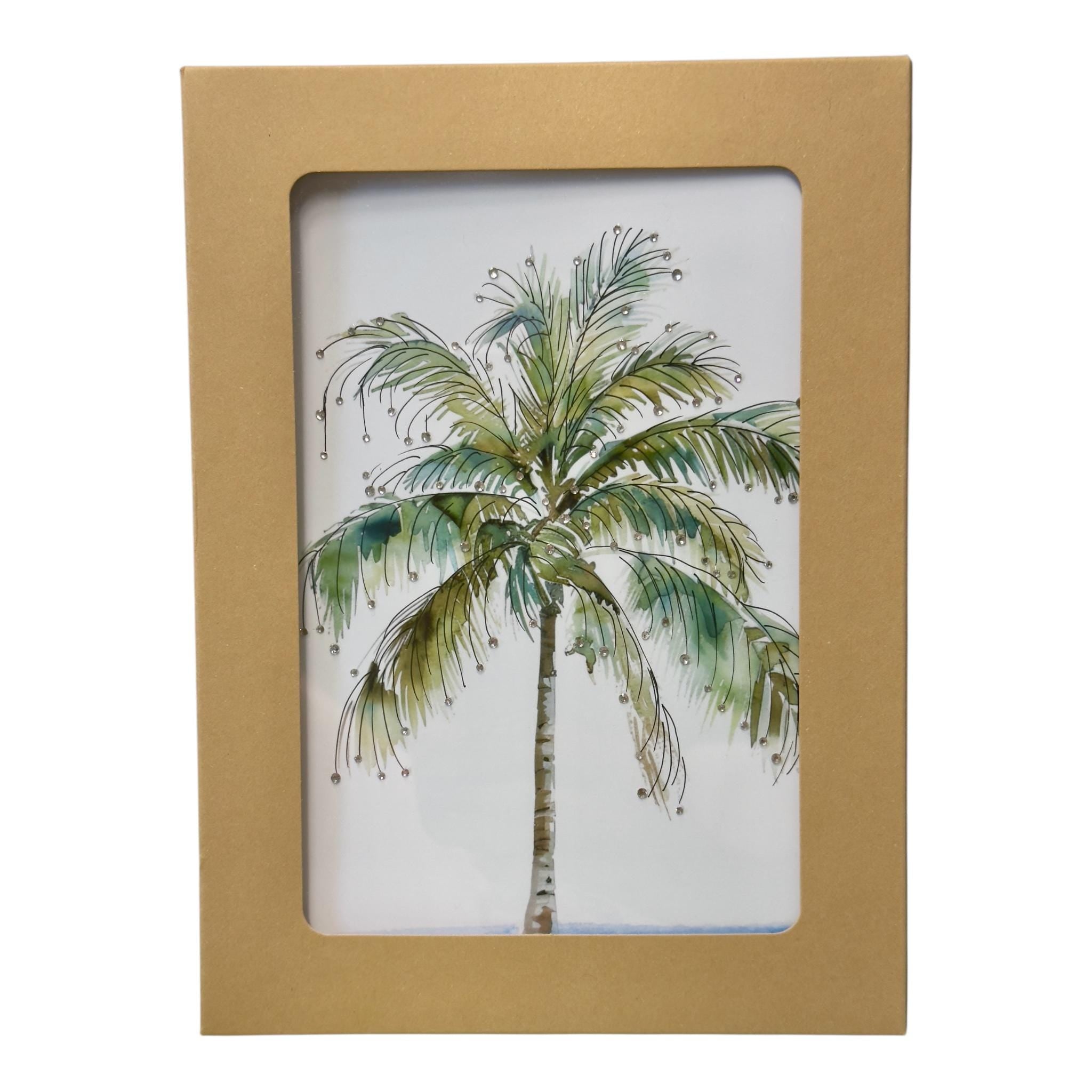 a framed painting of a palm tree with green leaves and brown trunk.