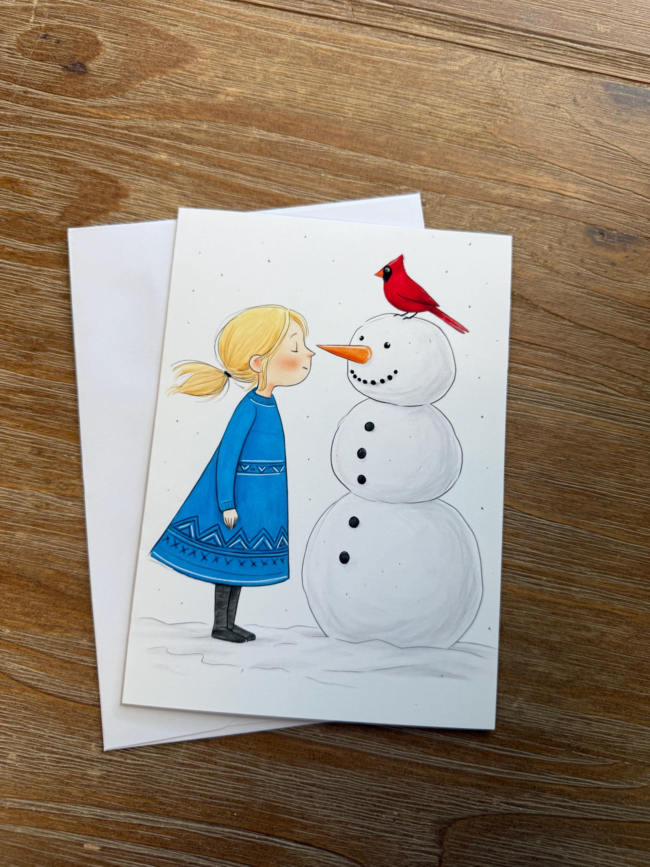 A hand-drawn illustration of a snowman with a red bird perched on its head, accompanied by a young girl in a blue dress.