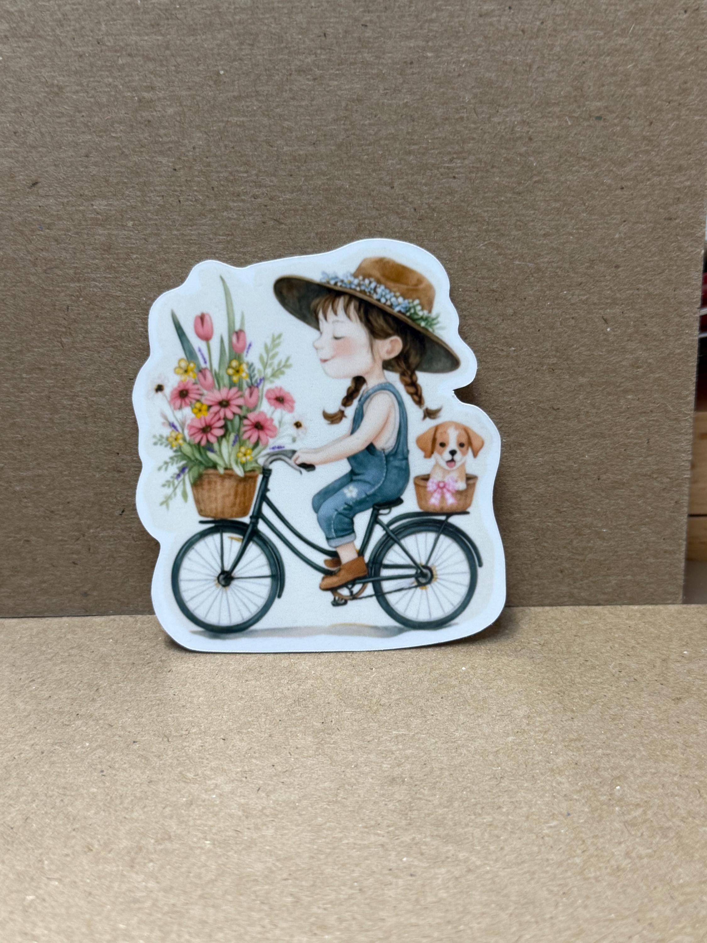 A sticker depicting a young girl riding a bicycle with a basket of flowers.