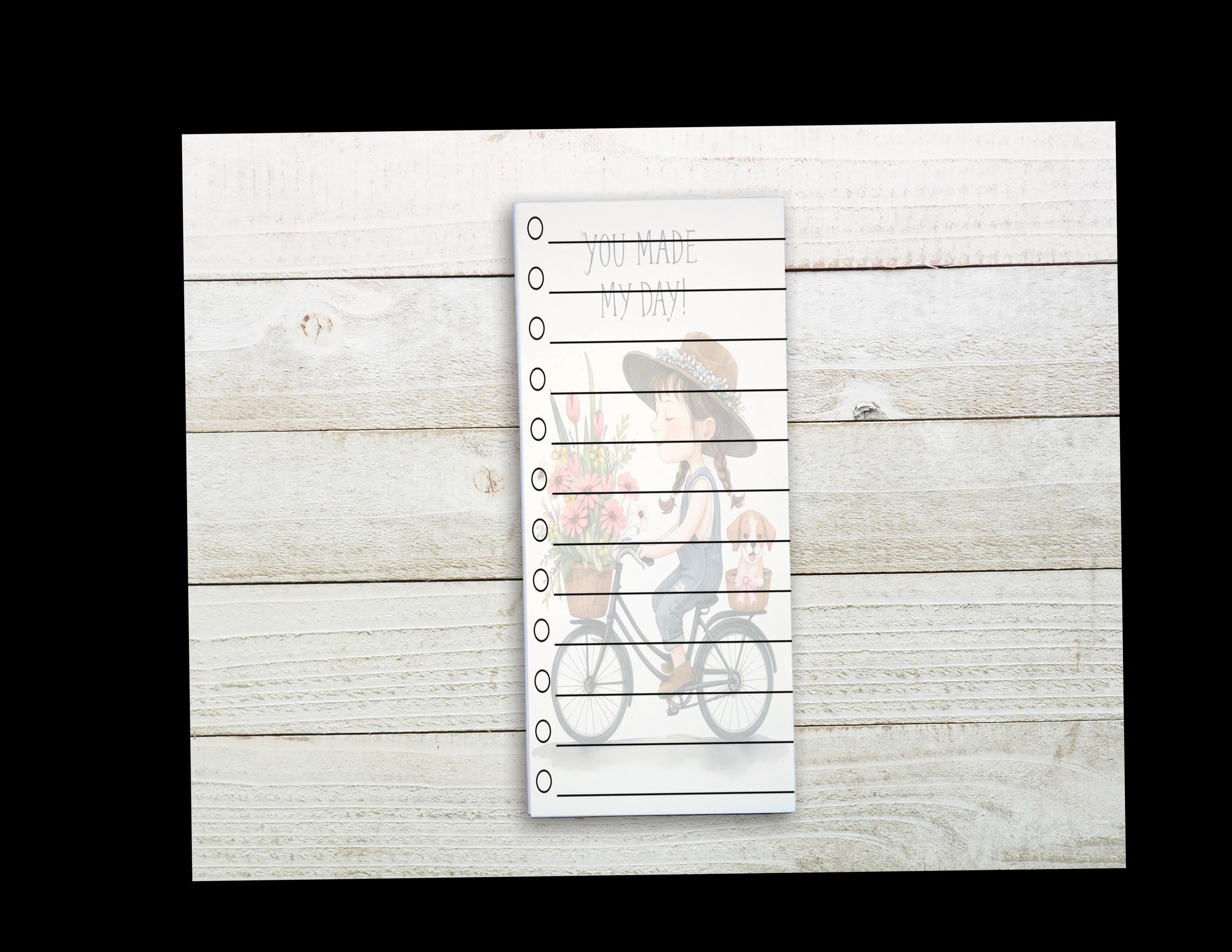 A white piece of paper with a list of items written on it, placed on a wooden surface.