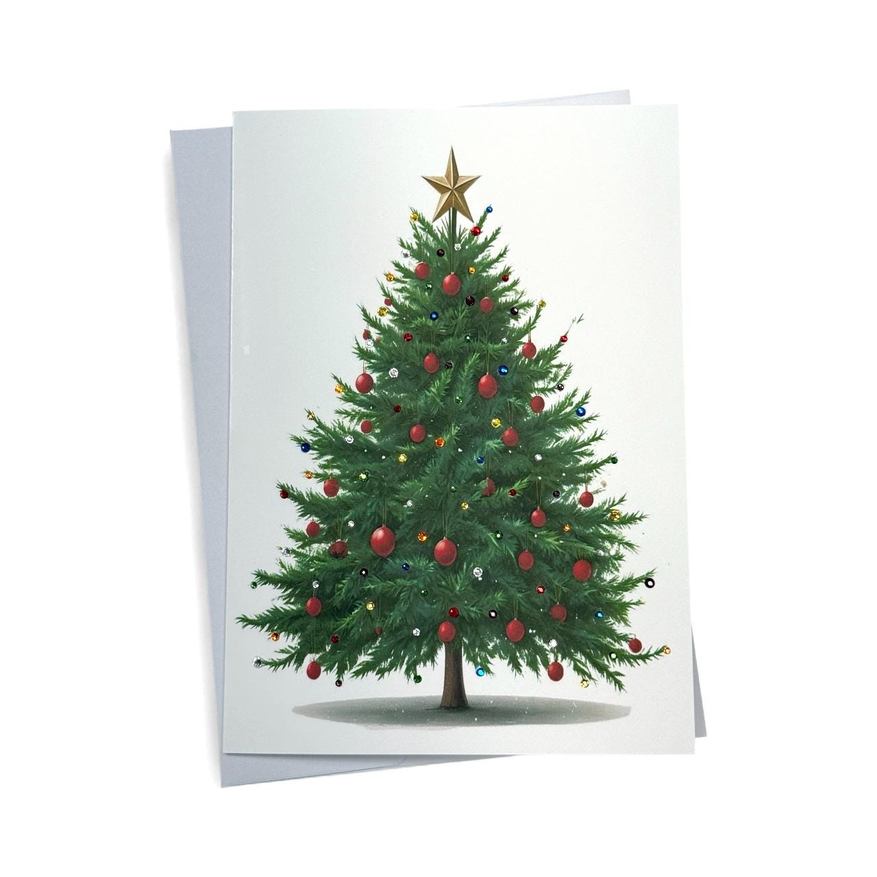 A large, beautifully decorated Christmas tree with red ornaments and a gold star on top, set against a plain white background.